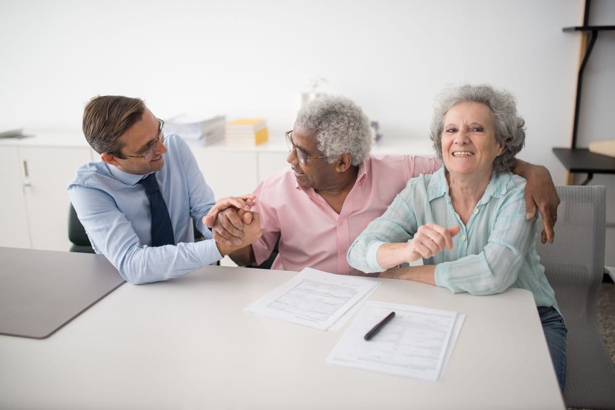 A licensed Florida insurance agent reviewing plan options with a happy couple