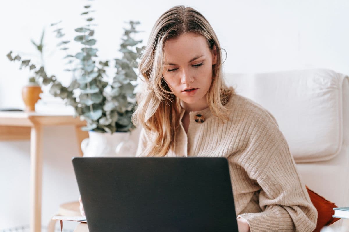 A self-employed Floridian comparing health insurance options on a laptop at home