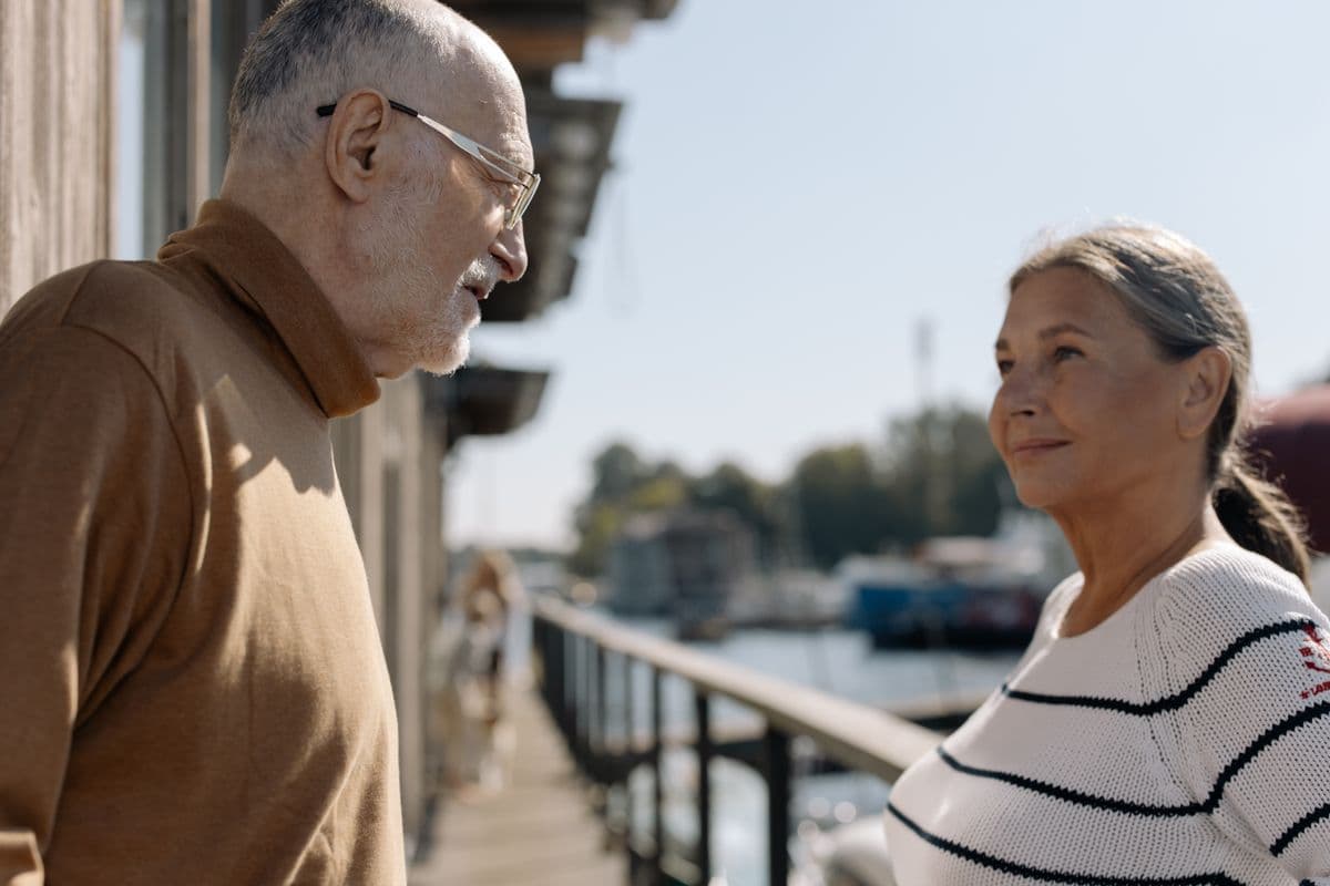 A happy retired Florida couple enjoying a sunny day by the water